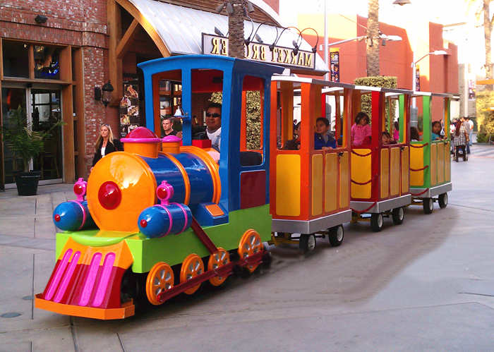 kids-ride-on-tourist-trains-at-amusement-park